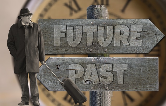 Person standing in front of a sign that says future and past