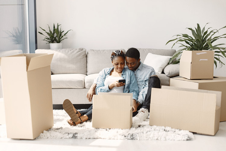 Young couple settling in to new home